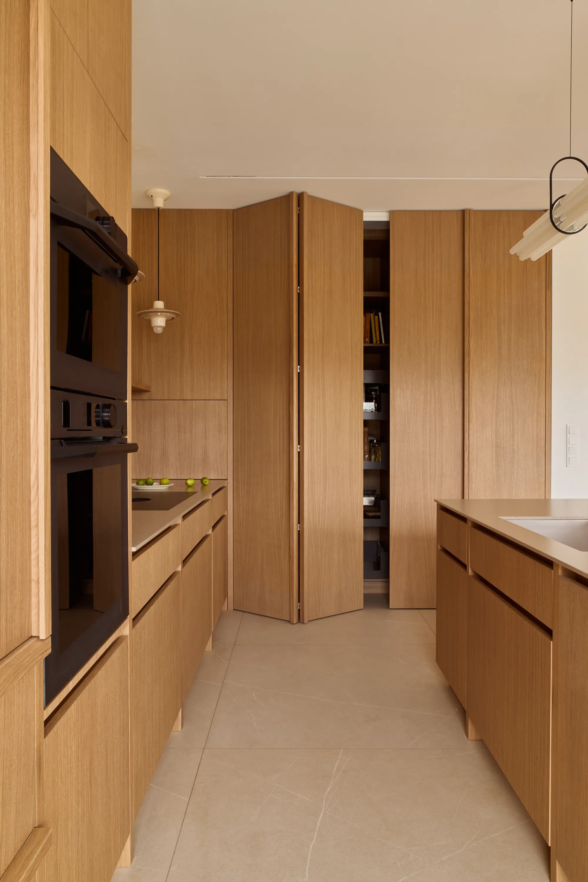 Oak cabinetry with refined slab fronts and integrated pulls
