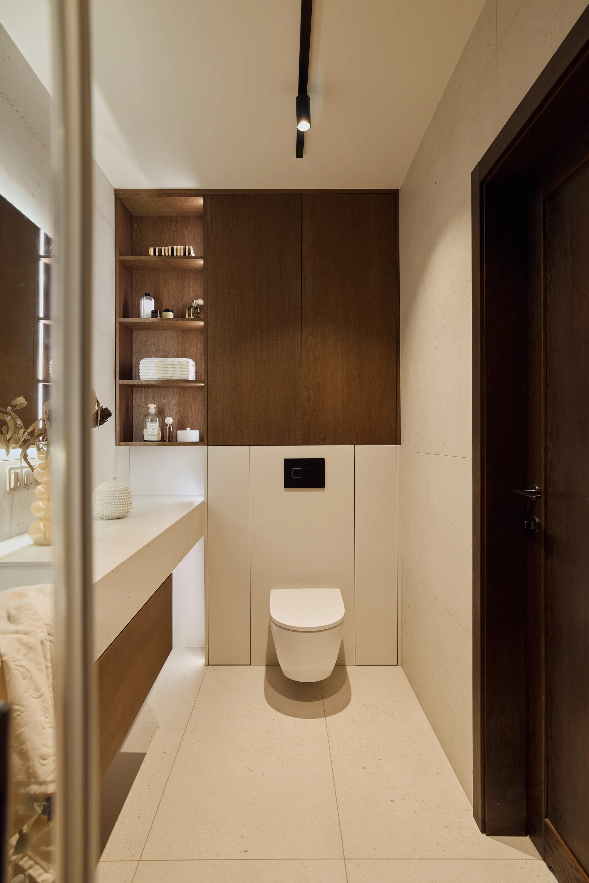 Brown oak cabinetry with curved profiles and refined finishing